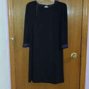 Elegant Black Dress with Embellished Sleeves
